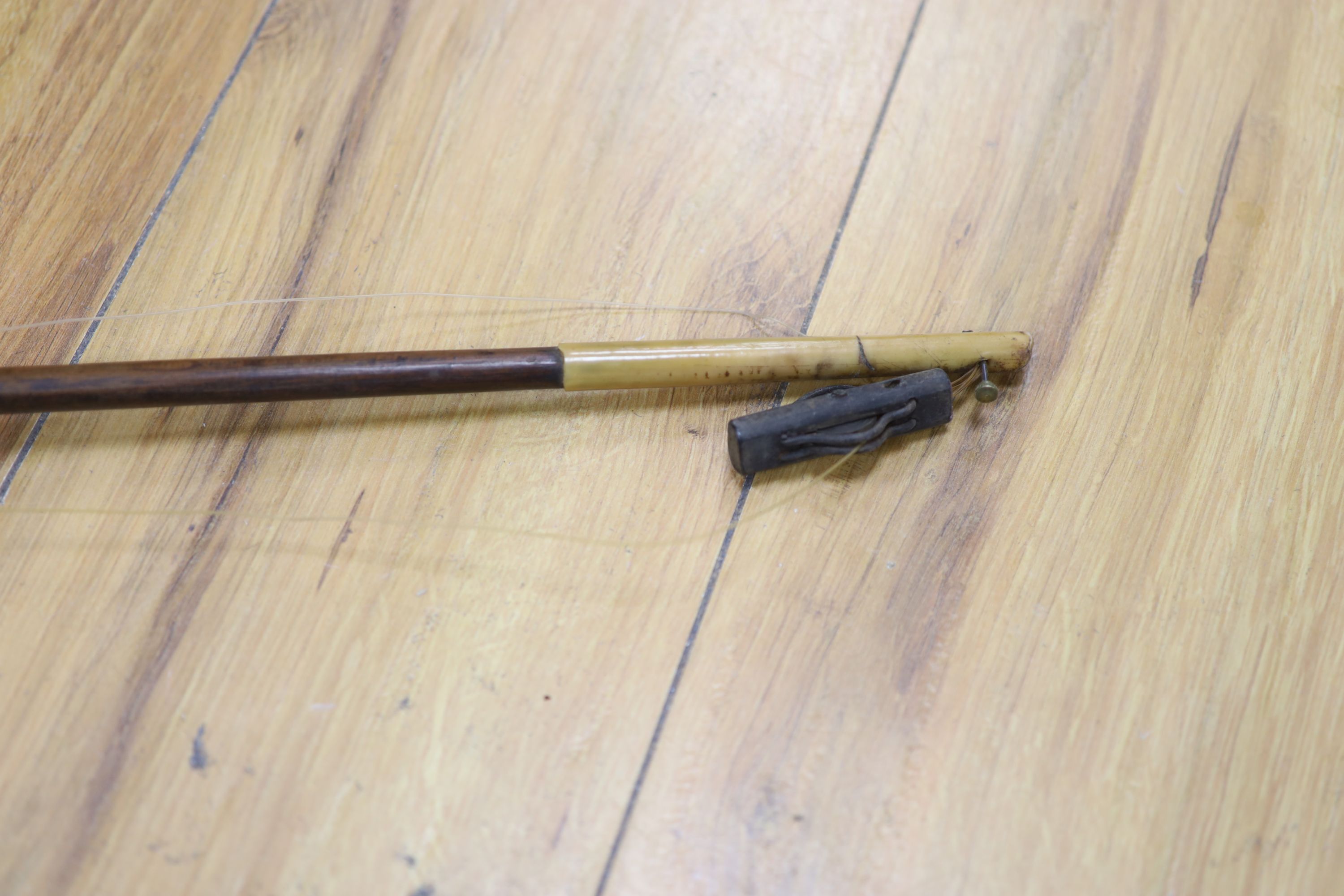 A Chinese wood and bamboo fishing rod with reel, Qing Dynasty, approx. length 142cm